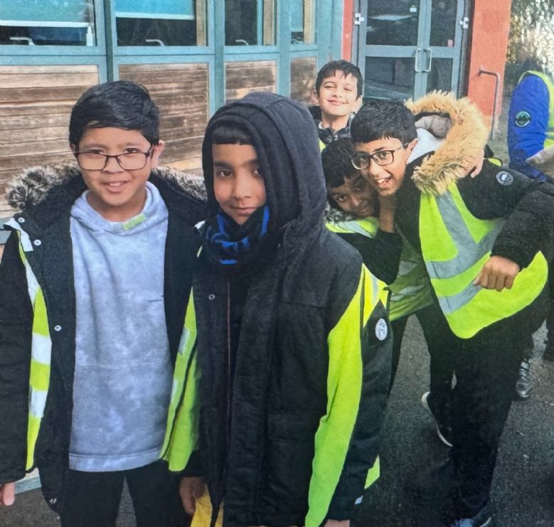 Children in walking high vis walking.