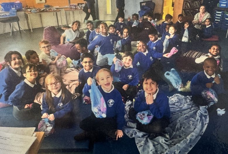 Children having a pizza party in class.